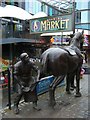 Stables Market shoeing a horse sculpture