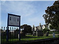 Board outside St Andrew, Oving