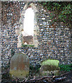 The ruined church of St Margaret - two old headstones