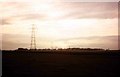 Sun sets on pylons  near The Flouch