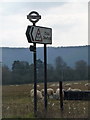 ST8211 : Shillingstone: road sign and sheep near Lamb House Farm by Chris Downer