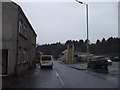 Traffic waiting at the level crossing near Coed Trecastell on a rainy day