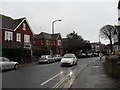 Headlights on during a murky afternoon in Shelley Road