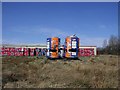 Two big Irn Bru cans