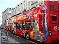 TQ3181 : Colourful tour bus in Ludgate Hill by Basher Eyre