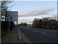 Road sign on approach to roundabout