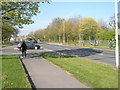 Approaching the junction of  Milton Road and  Dryden Close