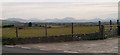 View across the gateway of Fferm Cromlech towards Snowdonia