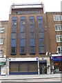 TQ3381 : College in Aldgate High Street by Basher Eyre