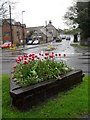 Looking from a flower bed in Bustice Lane into West Street