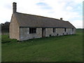 Cottage in pasture land