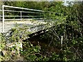 A bridge on the River Yeo, which leads to the Bulldog fish farm, as seen from Downstream