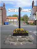 TA0979 : Signpost and cross base in Muston by John S Turner