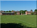 Cricket pavilion and houses, Michelmersh