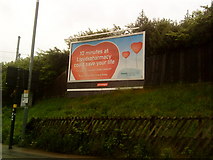 SP0482 : Advertisement near Selly Oak Railway Station by Andrew Abbott