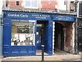 NY9364 : Gordon Caris, Clock &  Watch Repairer, Market Place by Mike Quinn