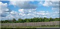 J0302 : Motorway shelter fence near Dunmahon Castle by Eric Jones