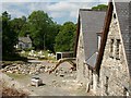 View past the uncompleted cottages to the Riverside Cafe