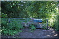 Gate across disused section of A48 leading to Sewage works