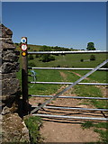 SK0952 : Gate and public footpath above River Hamps Valley by Tim Marshall