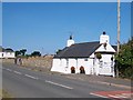 Traditional white washed cottage in Lon Gerddi