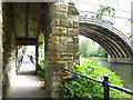 Footpath by the river Wear looking under Framwelgate Bridge.