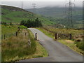 SH8539 : Minor Road with Pylon Line by Trevor Littlewood