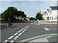 Cyclist passing the crossroads of Windsor Road and Church Walk