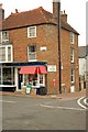 Corner shop with over-sized road direction sign, Old Bexhill