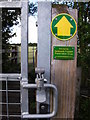 Detail of footpath gate and marker near Redfern Manor