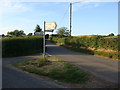 Road junction and sign near Gaerllwyd