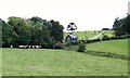 Gate lodge at Nanhoron viewed across pasture land