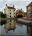 Canal and village scene with reflections