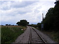TM4263 : Looking along the railway line to Leiston by Geographer