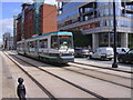 Tram Passing the "Premier Inn" 7-11 Lower Mosley Street, Manchester