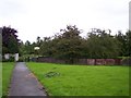 Remains of railway bridge parapet at entrance to King George V Playing Field