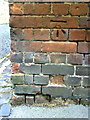 Benchmark on building at junction of Pusey Street and Pusey Lane