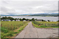 Road down to the houses and farm at Blackpark