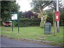 NZ2513 : Village notice board & postbox, Cleasby by Stanley Howe