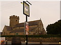 SS9379 : Coychurch: parish church of St. Crallo and White Horse pub sign by Chris Downer