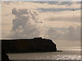 SR9792 : St. Govans Head: shapely clouds over headland by Chris Downer