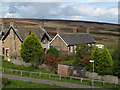 Houses below dam of Waskerley Reservoir