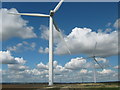 TQ9721 : Two Wind Turbines of Little Cheyne Court Wind Farm by David Anstiss