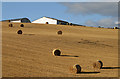 A stubble field and bales at Cortleferry