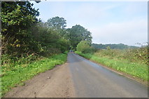 TG2134 : Road from Hanworth Cross by Ashley Dace