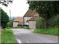 Flint and brick cottage in Sheringham Road, West Beckham