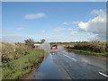 TM5079 : Flooded Road at Potter's Bridge by Adrian S Pye