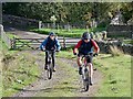 NY8855 : Mountain bikers on the track up to Burntridge Moor by Oliver Dixon
