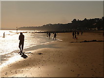 SZ0790 : Bournemouth: silhouettes enjoy the beach by Chris Downer
