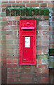 Victorian postbox in the wall of one of the barns by West Barsham Hall